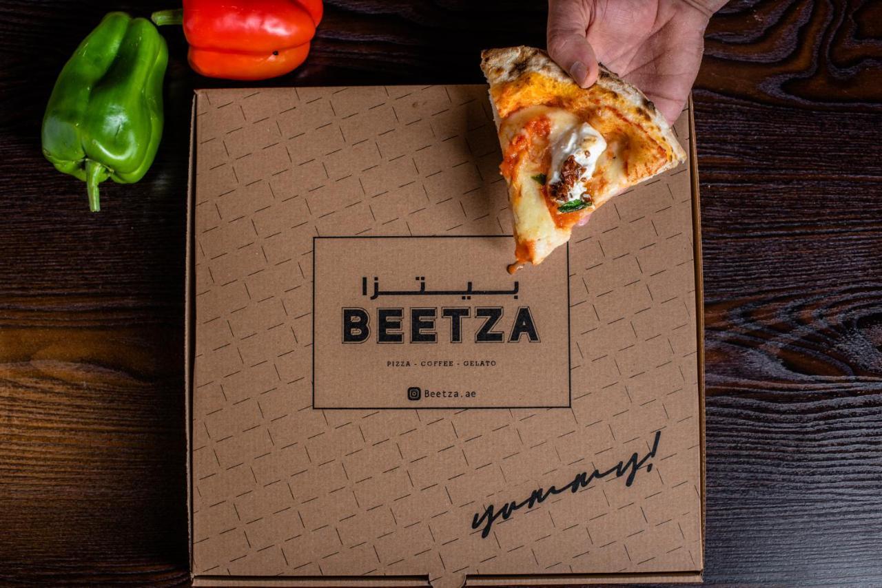 Officers Club & Hotel Abu Dhabi Exterior foto Beetza pizza